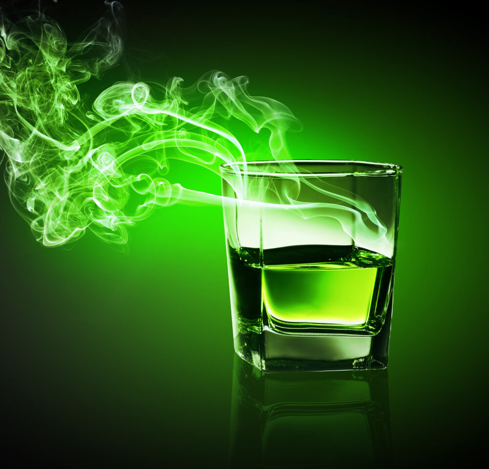 an etheric photo of a glass of alcohol with spirits rising from it